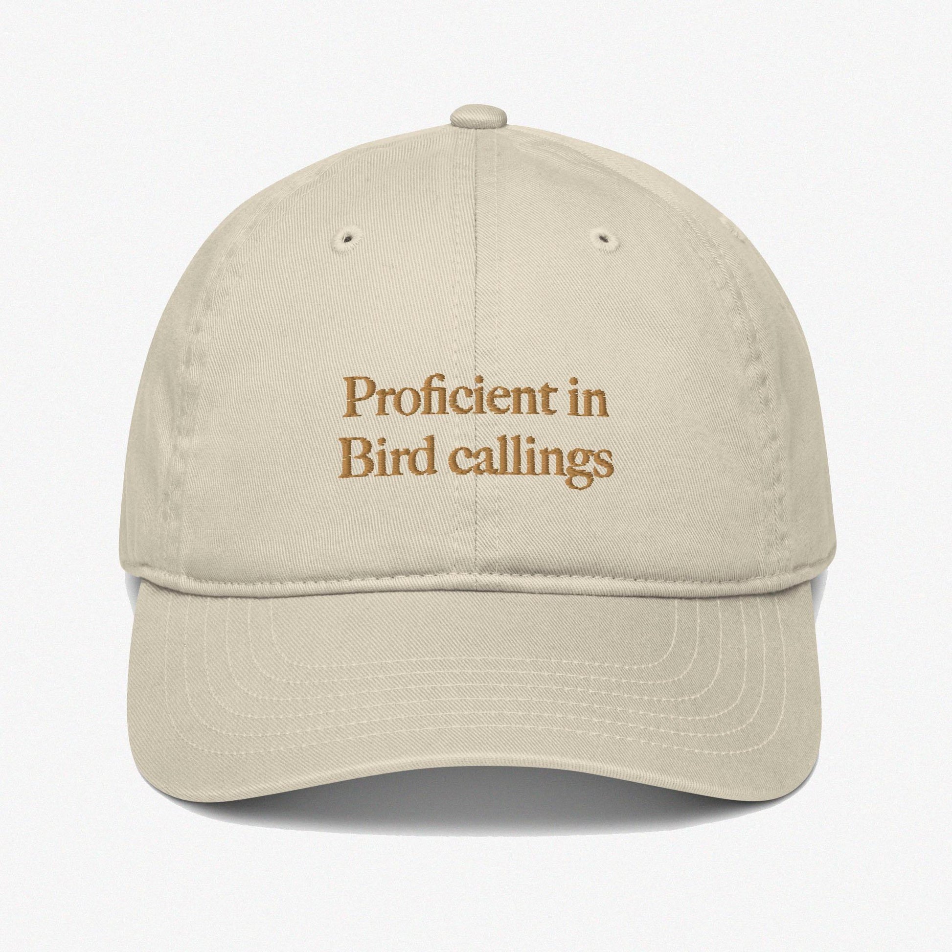 Beige dad hat, embroidered caption: Proficient in bird callings, Low profiles, 6 panels, Organic cotton